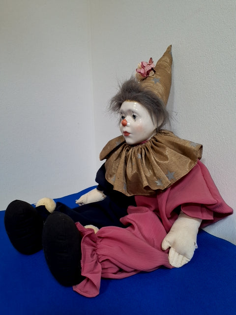 Pink-guld Harlekin dukke